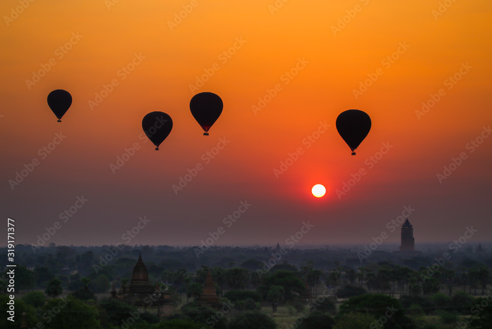 Balloons flying over the ancient pagodas in Bagan