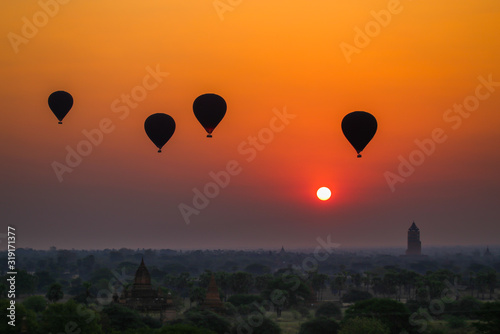 Balloons flying over the ancient pagodas in Bagan