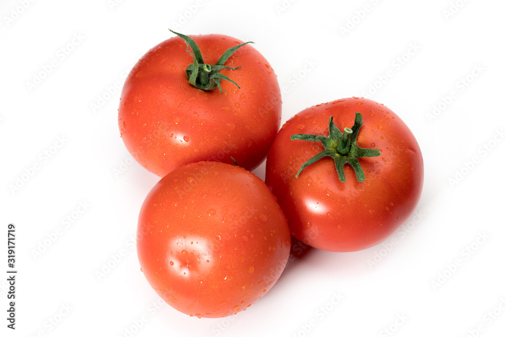 three fresh tomatoes with green leaves isolated on white background three fresh tomatoes with green leaves isolated on white background