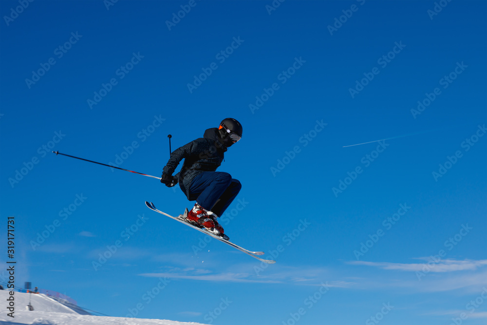 Skier jumps in air Skier jumps in air
