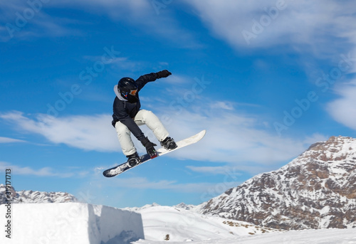 Snowboarder jumps in air