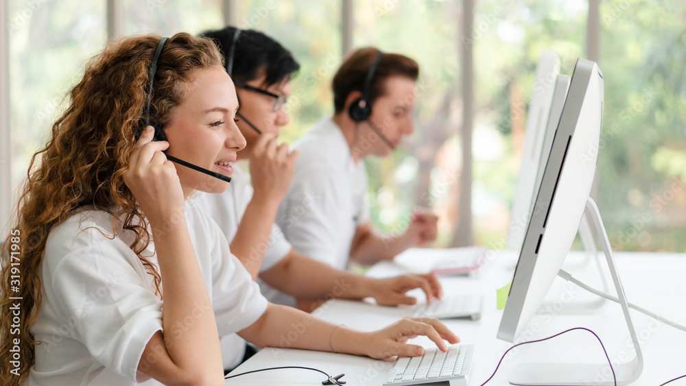 business background of customer service agents on telephone service to customers at helpdesk call center business background of customer service agents on telephone service to customers at helpdesk call center