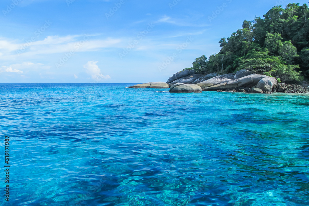 The water is clear until seeing the coral reef. At the Similan Islands, Phang Nga, Thailand