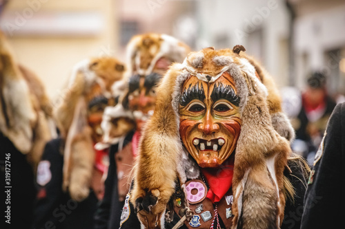 Canvas Print Festival participants dressed up in handmade costume and mask at the Ulmzug carnival event