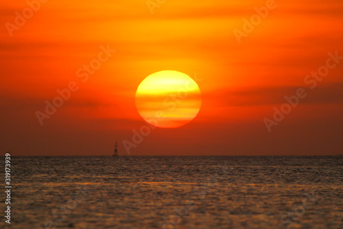 Fototapeta Naklejka Na Ścianę i Meble -  Fishing boat in the ocean on a sunset background