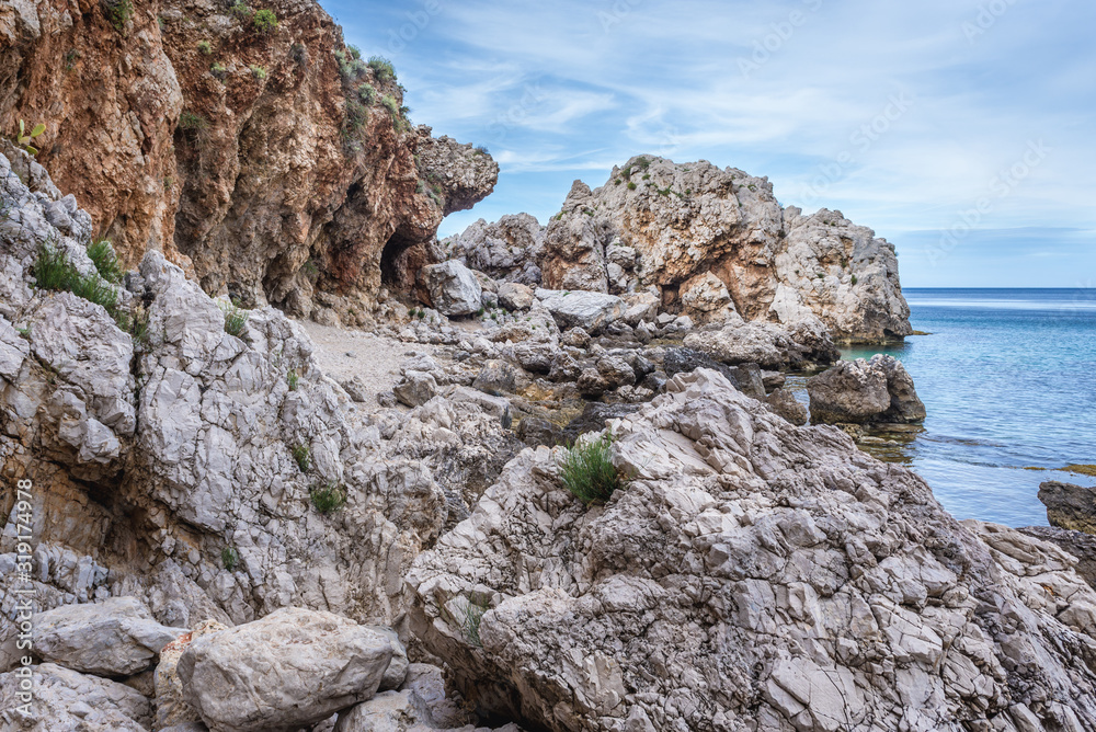 Rocsky shore of so called Disa beach in Zingaro park, oldest nature reserve on Sicily Island in Italy