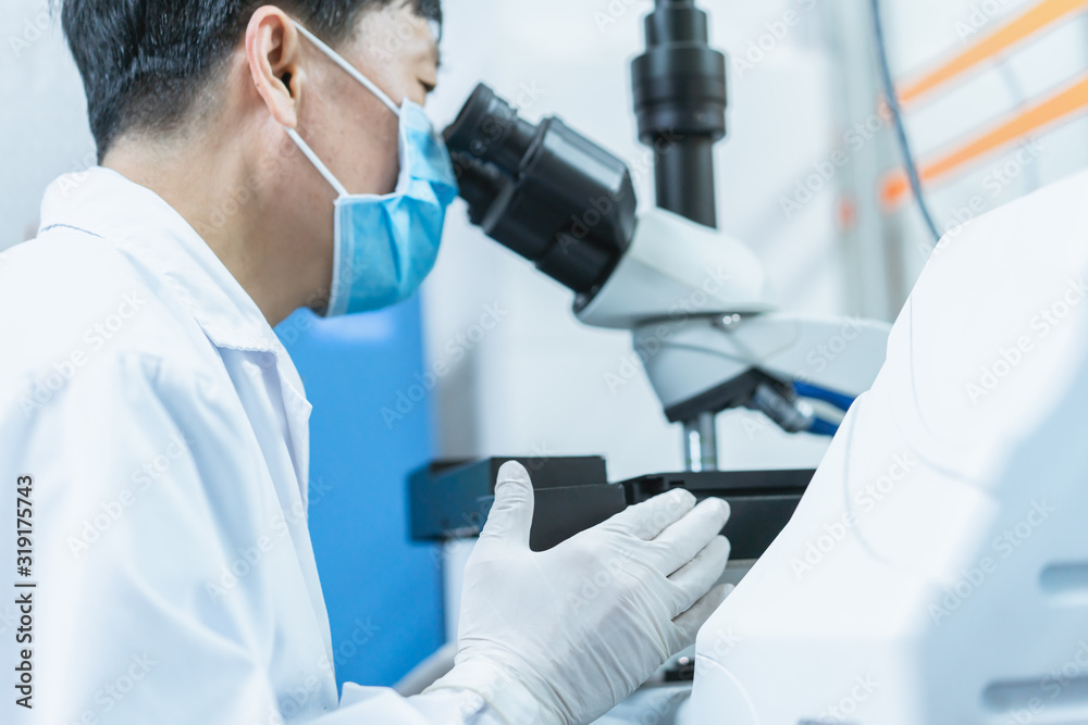 Doctor is using microscope to observe samples Doctor is using microscope to observe samples