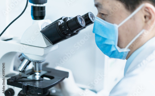 Doctor is using microscope to observe samples