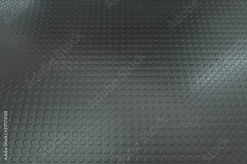 Gray studded rubber flooring background