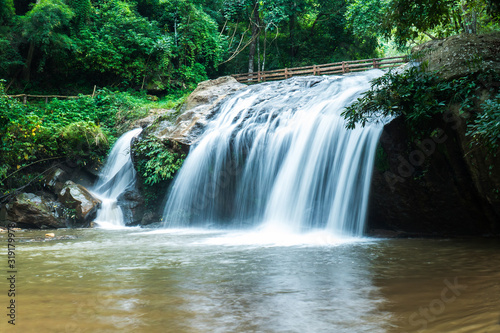 Mae Sa waterfall in Chiang Mai, Thailand. Beautiful Maesa waterfall in cool day light with green trees in Chiangmai province, Thai