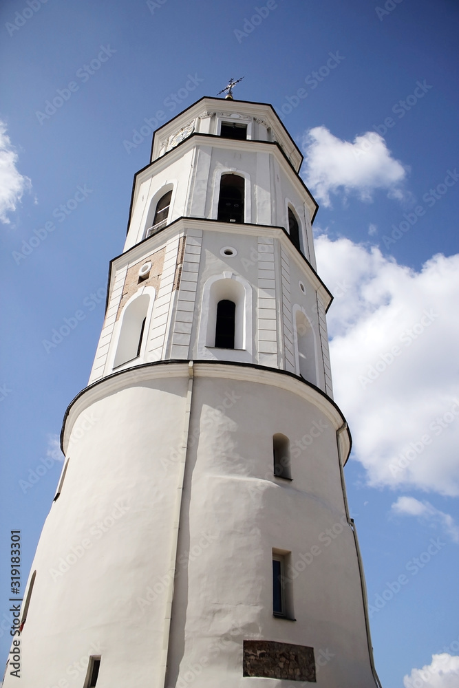 Vilnius cathedral square bell tower on blue sky background with clouds