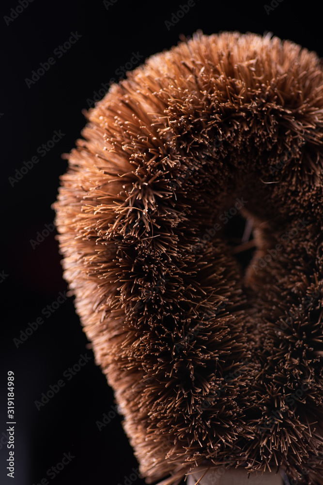 Close-up of a coconut cleansing brush. Zero waste concept Close-up of a coconut cleansing brush. Zero waste concept