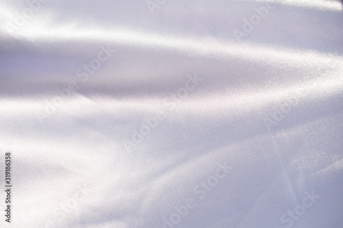 streak of silver fabric abstract background © Triam