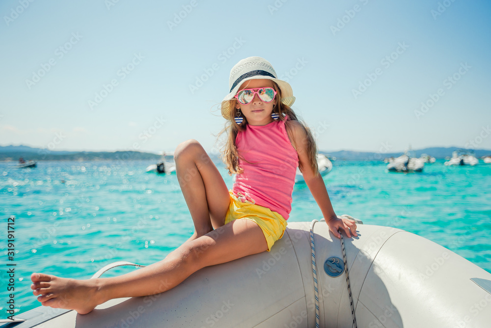 Adorable little girl at beach during summer vacation Adorable little girl at beach during summer vacation