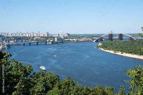 Ukraine, Kiev city – 24.07.2012: construction of the Podolsk-Voskresensky bridge across the Dnieper River. landscape