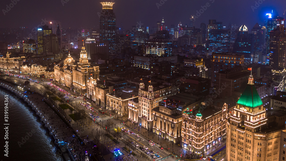 Fototapeta premium The bund at night, The Bund is a financial district and business centre in the city, Shanghai Bund historical buildings old colonial buildings, Popular tourist destination, Aerial view, China.