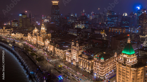 The bund at night, The Bund is a financial district and business centre in the city, Shanghai Bund historical buildings old colonial buildings, Popular tourist destination, Aerial view, China. photo