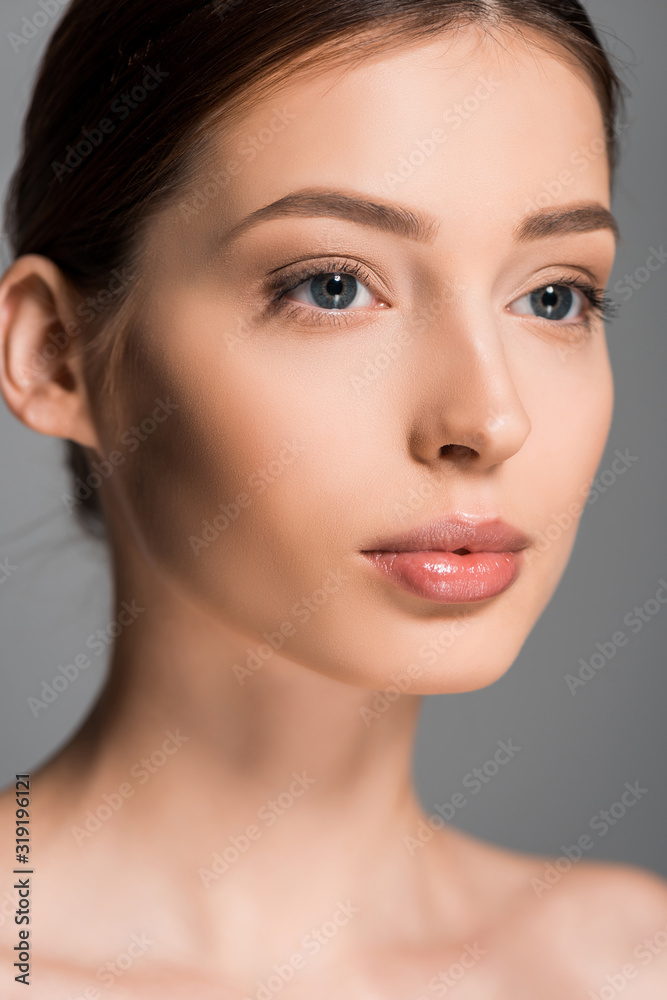 portrait of beautiful girl with perfect skin, isolated on grey