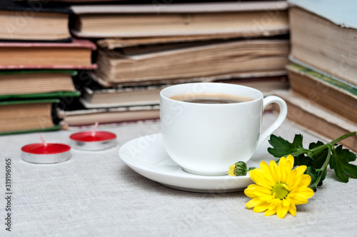 cup of coffee and yellow flower
