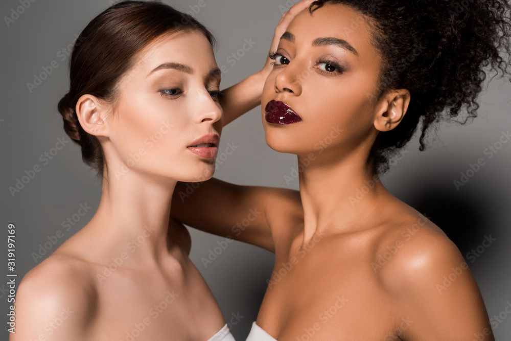 portrait of beautiful multiracial girls with perfect skin, on grey portrait of beautiful multiracial girls with perfect skin, on grey