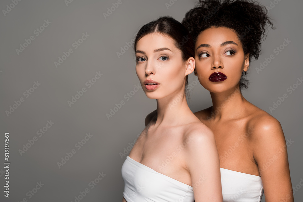 portrait of attractive multicultural girls with perfect skin, isolated on grey portrait of attractive multicultural girls with perfect skin, isolated on grey