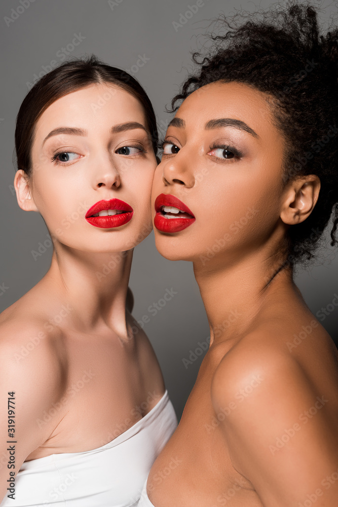 attractive multiethnic girls with red lips, isolated on grey attractive multiethnic girls with red lips, isolated on grey