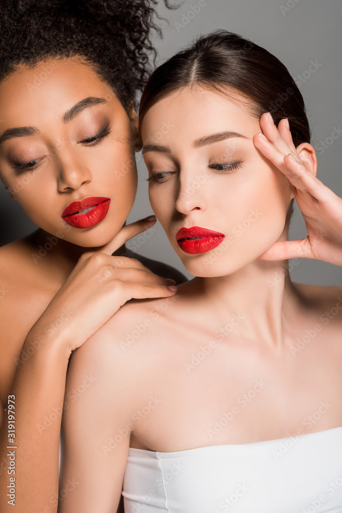 attractive nude multiracial girls with red lips, isolated on grey attractive nude multiracial girls with red lips, isolated on grey