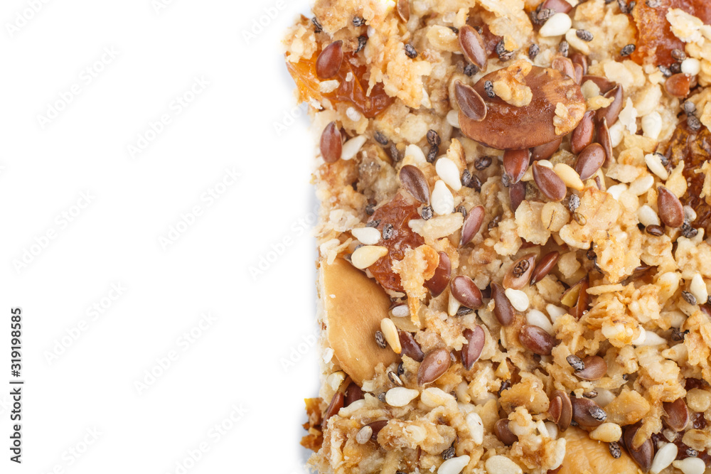 Homemade granola from oat flakes, dates, dried apricots, raisins, nuts isolated on white background. top view. Homemade granola from oat flakes, dates, dried apricots, raisins, nuts isolated on white background. top view.