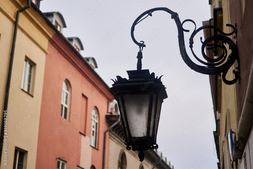 Old lantern on the wall of a building.