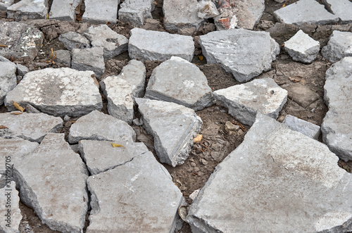 Pieces of concrete slab on the road