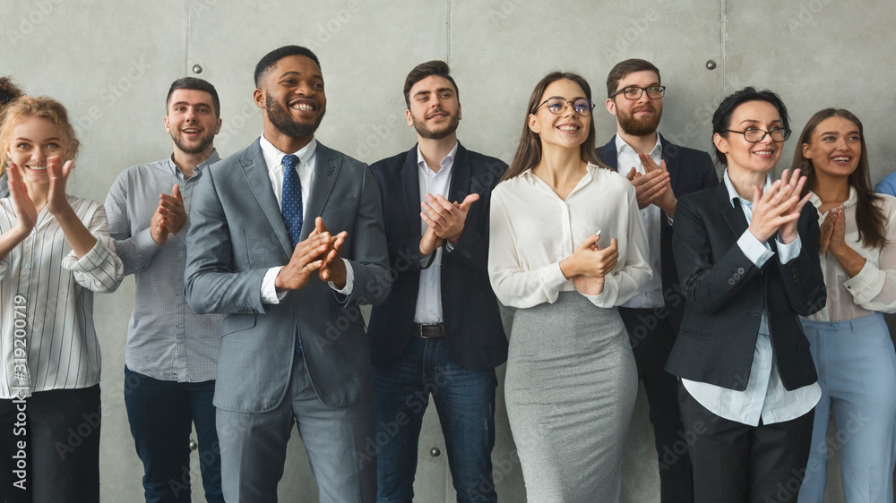 Diverse business colleagues clapping hands after meeting Diverse business colleagues clapping hands after meeting