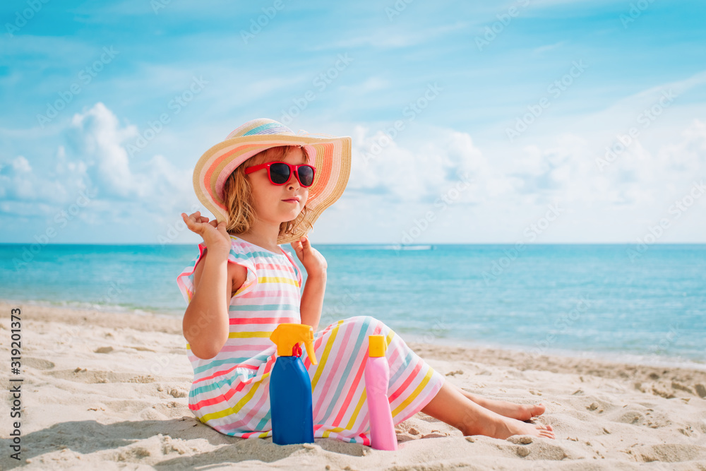 cute girl with suncream at beach vacation, sun protection cute girl with suncream at beach vacation, sun protection