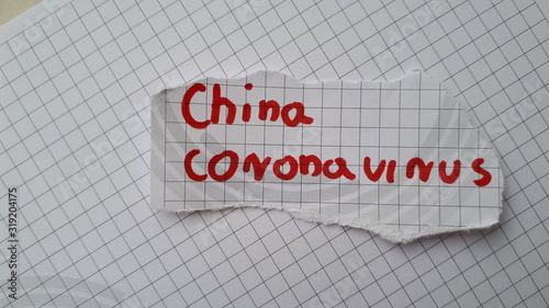 Coronavirus (2019-nCoV) lettering on the sheet of paper. Coronavirus (2019-nCoV), MERS-Cov (middle East respiratory syndrome coronavirus). Pandemic virus. Chinese, Wuhan.