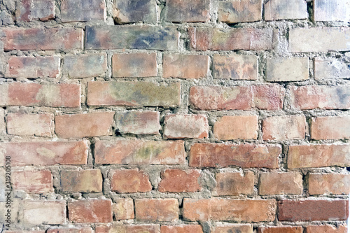 Dirty brick wall with spots and stains  old decorative wall