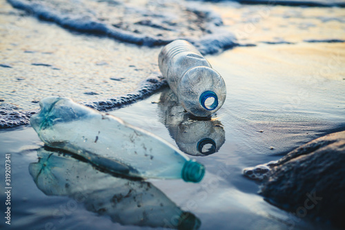 Fototapeta Naklejka Na Ścianę i Meble -  environmental pollution, used plastic bottles floating in ocean