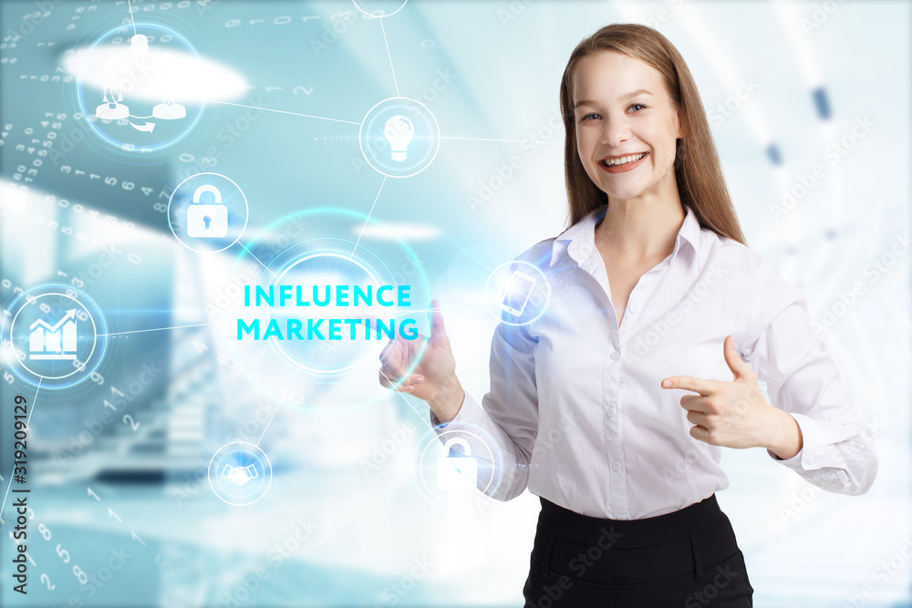 Business, Technology, Internet and network concept. Young businessman working on a virtual screen of the future and sees the inscription: Influence marketing Business, Technology, Internet and network concept. Young businessman working on a virtual screen of the future and sees the inscription: Influence marketing