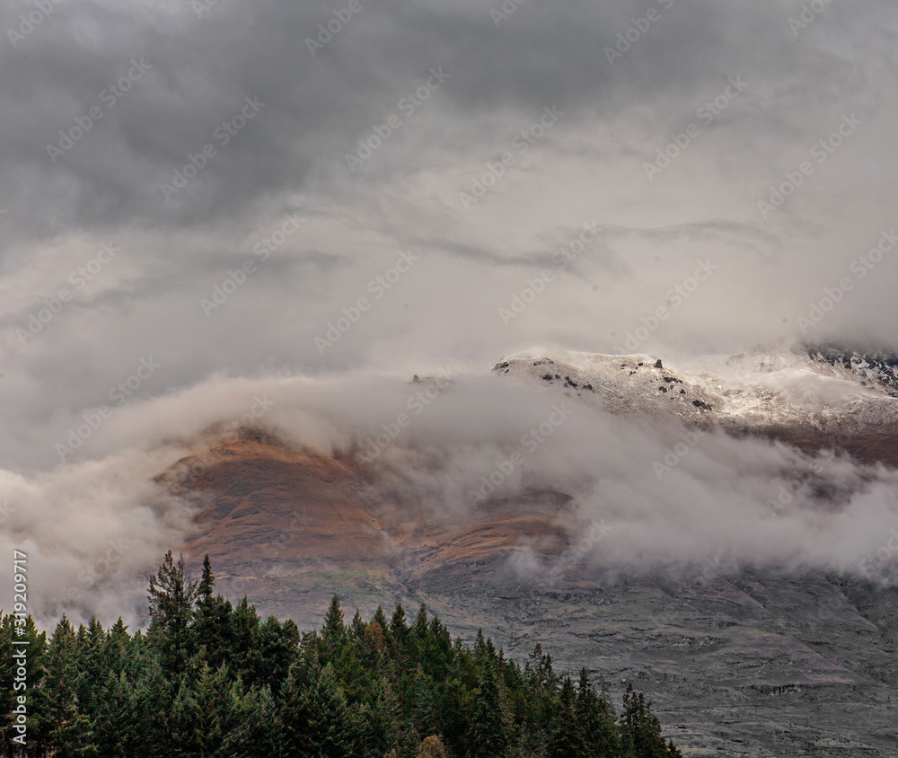 Queenstown New Zealand. Clouds. Snow. Mountains