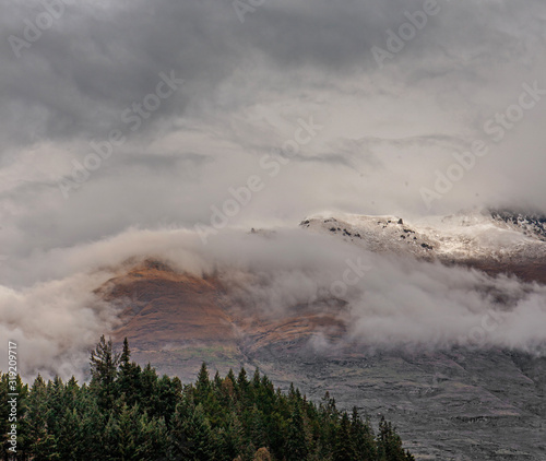 Queenstown New Zealand. Clouds. Snow. Mountains
