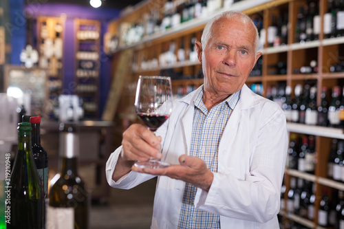 Vintner proposing degustation of wine