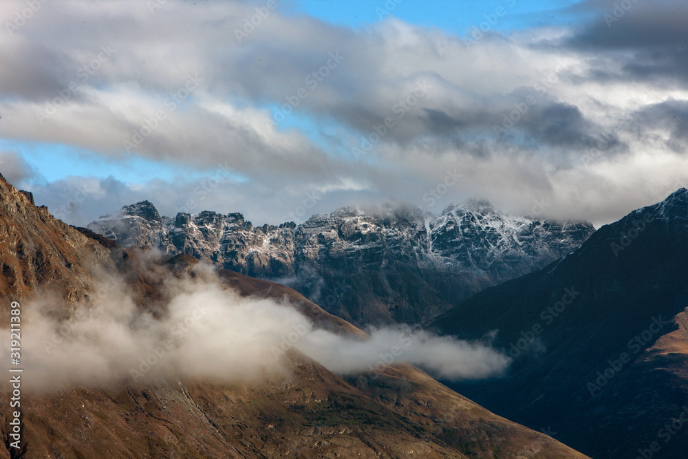 Queenstown New Zealand. Mountains. Clouds. Snow. Aerial. Lake Wakatipu