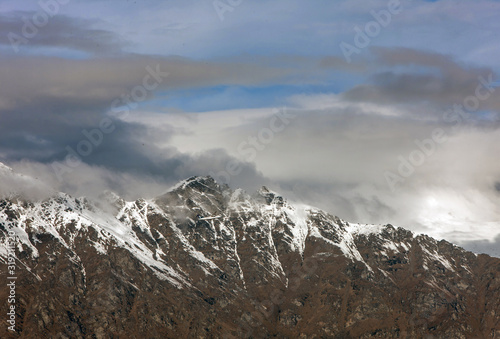 Queenstown New Zealand. Mountains. Clouds. Snow. Aerial. Lake Wakatipu