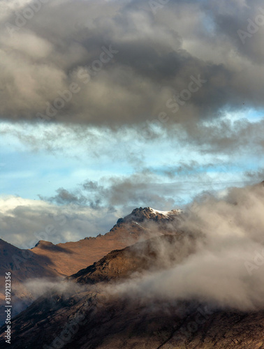 Queenstown New Zealand. Mountains. Clouds. Snow. Aerial. Lake Wakatipu