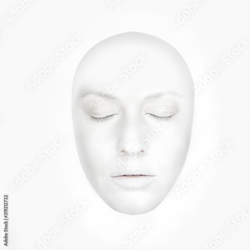 Front portrait of the woman with white face like a mask - isolated on white