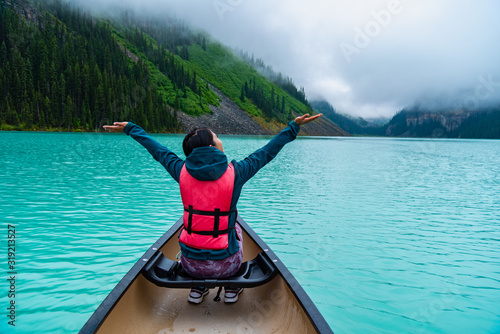 Woman enjoying the view of Lake Louise from Canoe