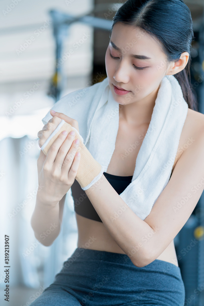 sport accident concept body hurt in gym asian female hand touch body part with pain from wrong action workout in fitness gym sport accident concept body hurt in gym asian female hand touch body part with pain from wrong action workout in fitness gym