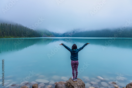 Woman enjoying view of Lake Louise Alberta Canada © ujjwal