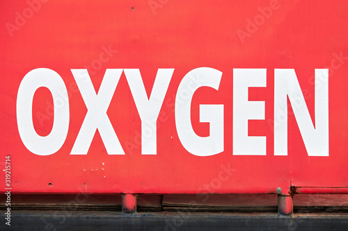White colored Oxygen signage on a red painted old delivery truck, seen in the Visayas, Philippines