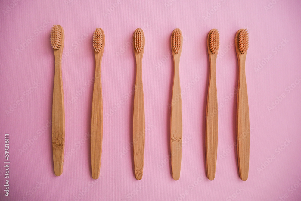 wooden bamboo toothbrushes on pink background wooden bamboo toothbrushes on pink background