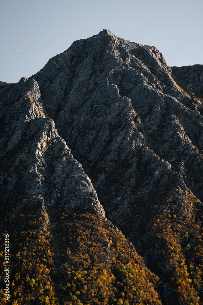 Amazing mountain formation looks like mountains are dancing. Lovely soft and warm and calming fall colours.  Located in Lofoten Islands, Norway.