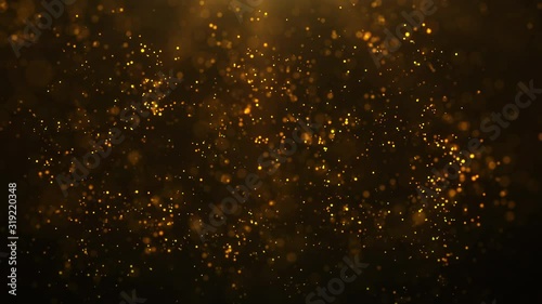 gold particles abstract background with golden shining stars dust bokeh glitter awards dust. Futuristic glittering fly movement flickering loop in space on black background. photo